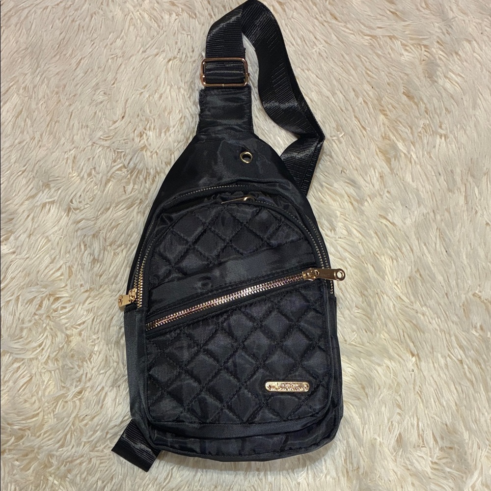 Black Quilted Sling Bag with Gold Accents‎